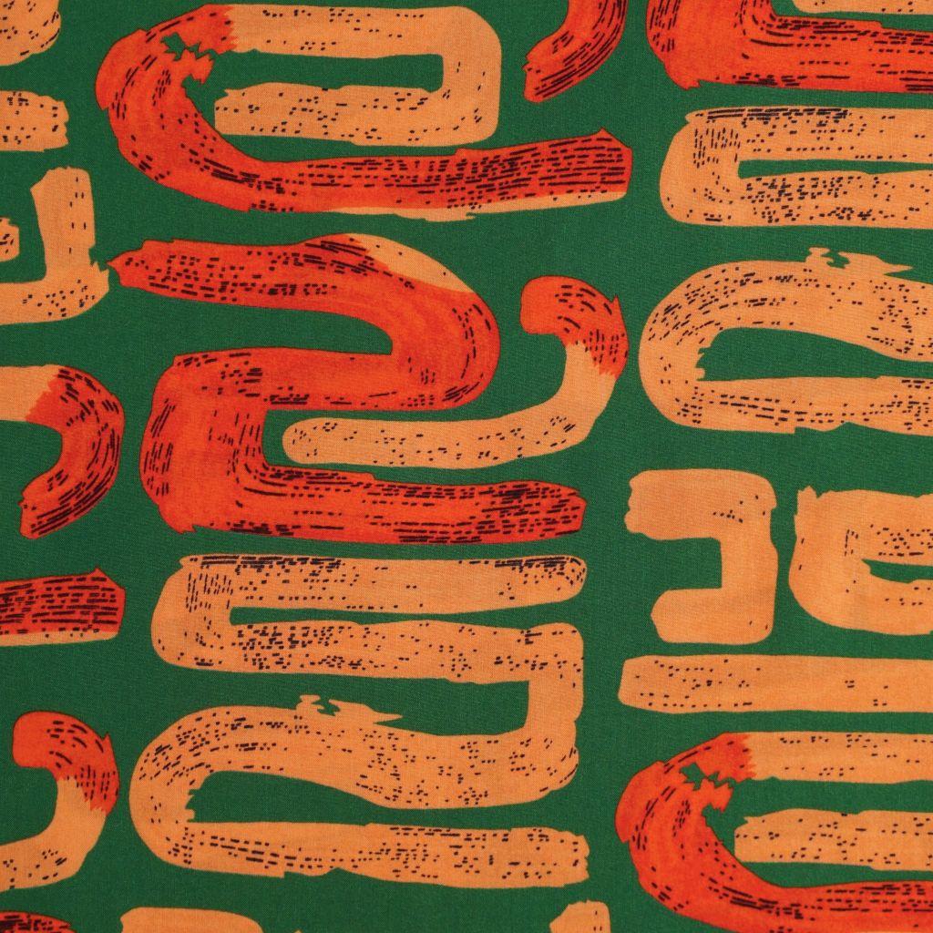Preview: Viskose Druck grafisches Muster apricot rot grün